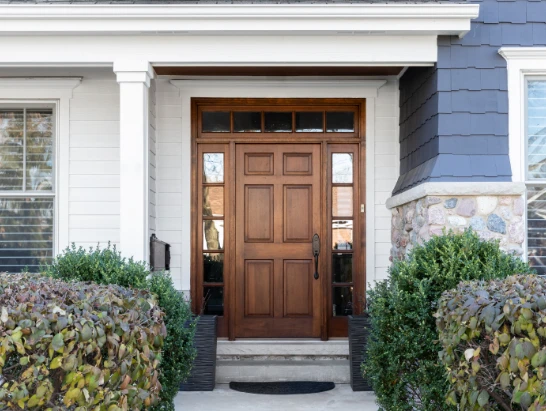 front porch with wooden door