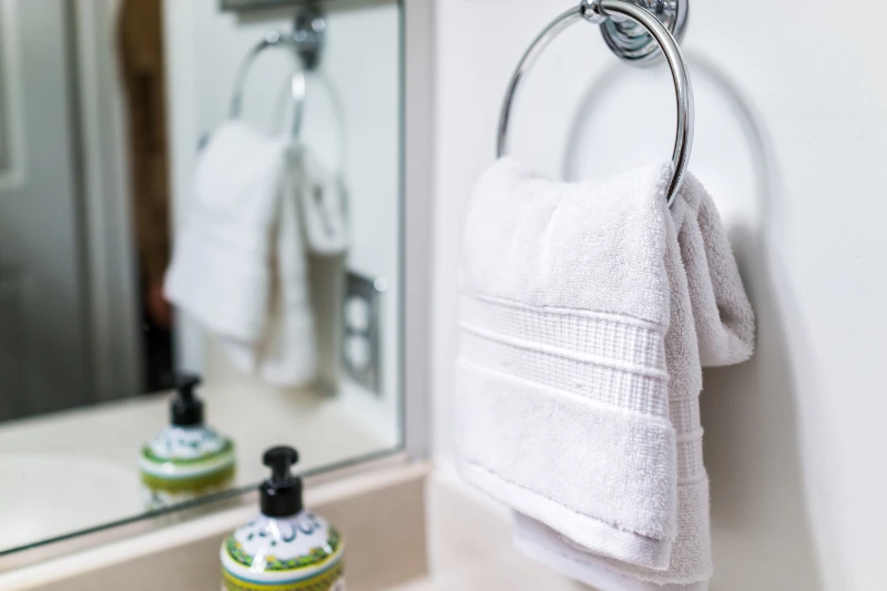 white towel on a silver towel ring